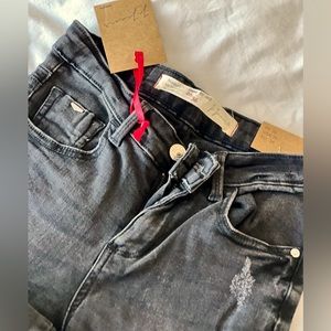 Dark wash skinny ripped grey jeans.